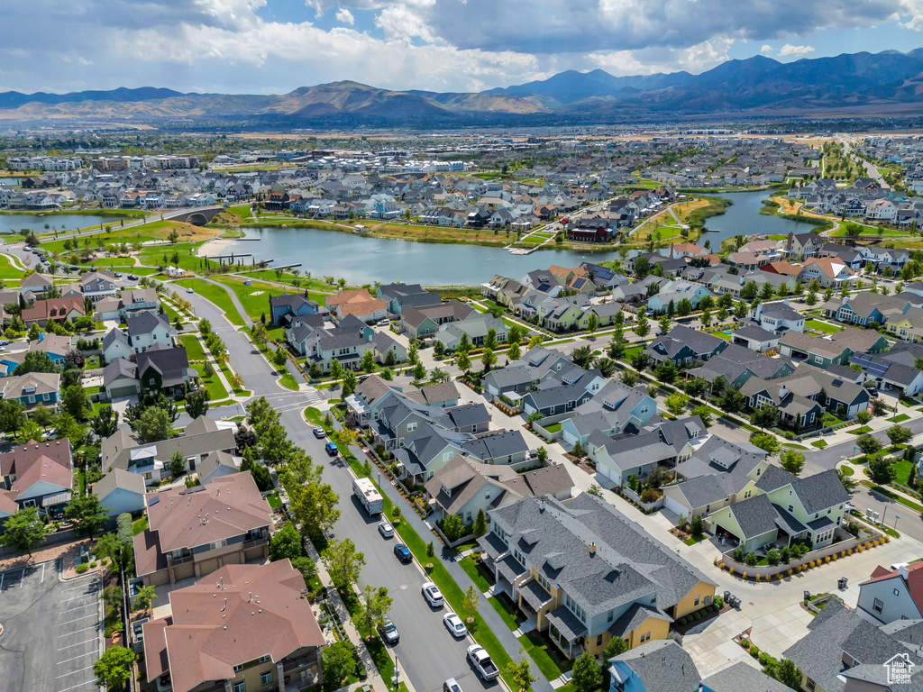 Drone / aerial view with a residential view and a water and mountain view