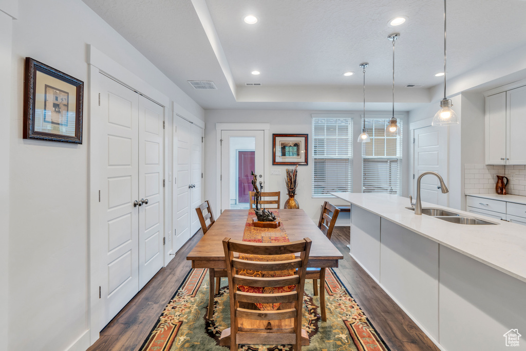Dining area featuring recessed lighting, visible vents, baseboards, and dark wood-style floors