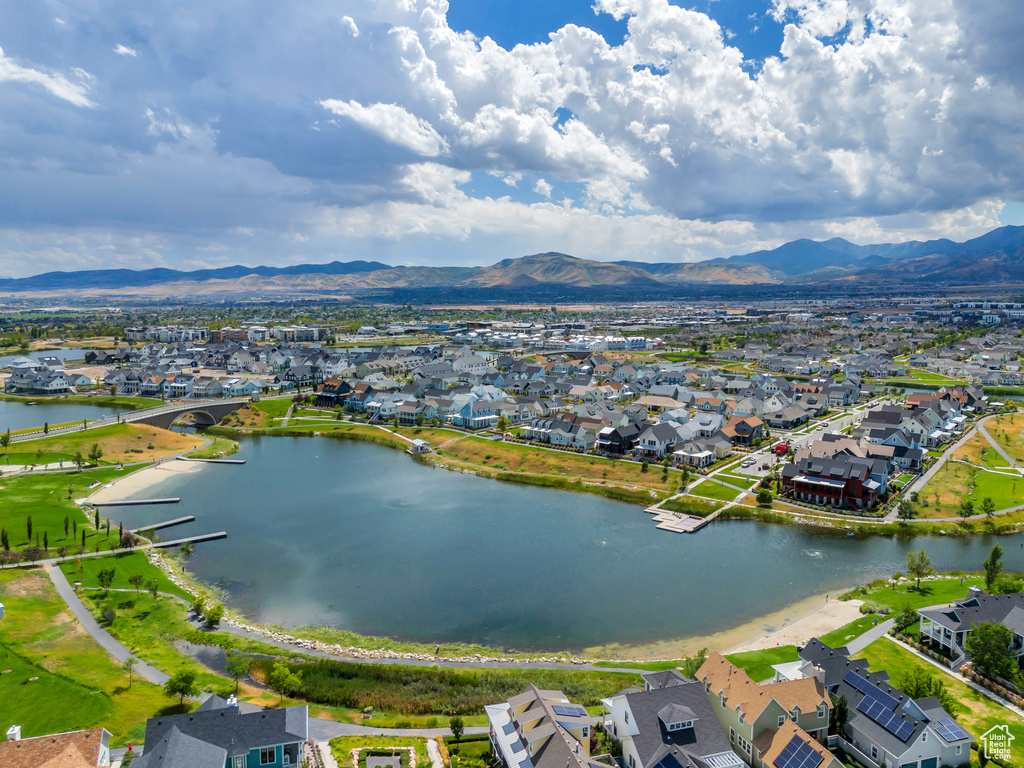 Birds eye view of property featuring a residential view and a water and mountain view