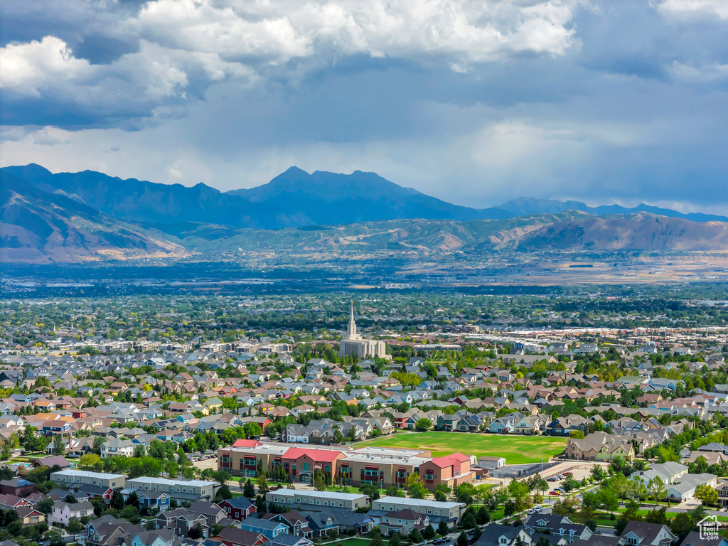 Drone / aerial view featuring a mountain view and a residential view