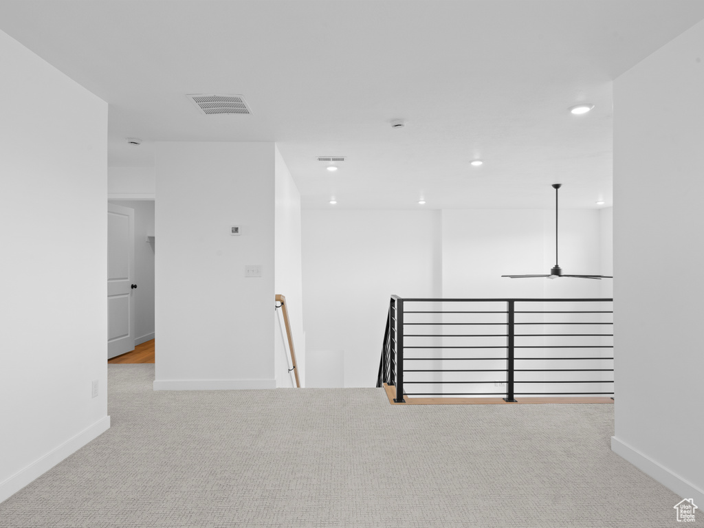 Unfurnished room featuring recessed lighting, visible vents, carpet floors, and baseboards