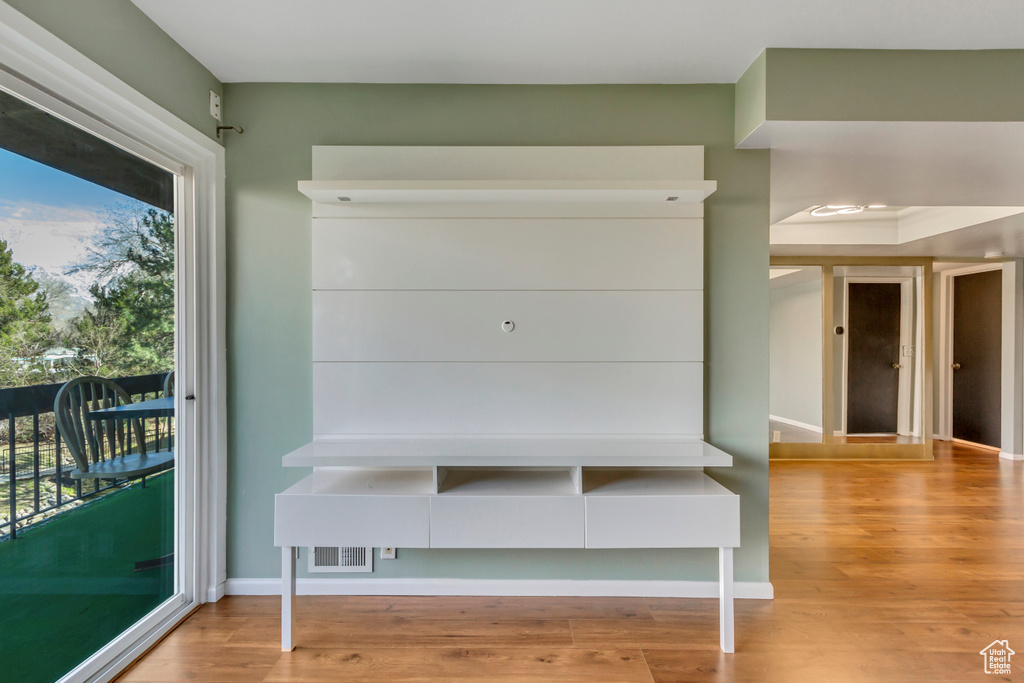 Mudroom featuring baseboards and wood finished floors