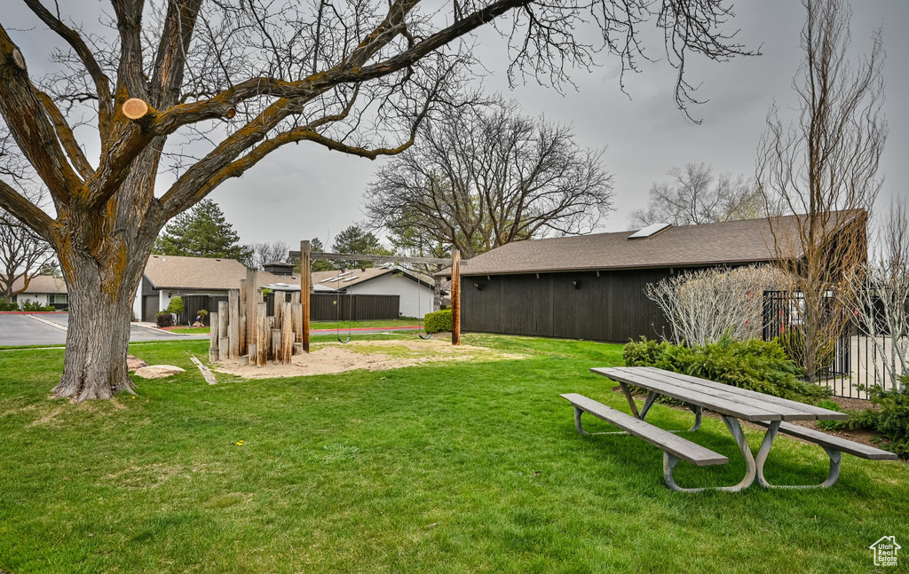 View of yard featuring fence