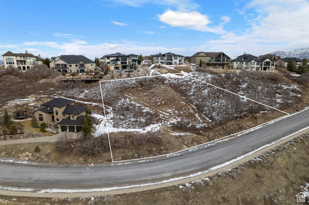 Snowy aerial view with a residential view