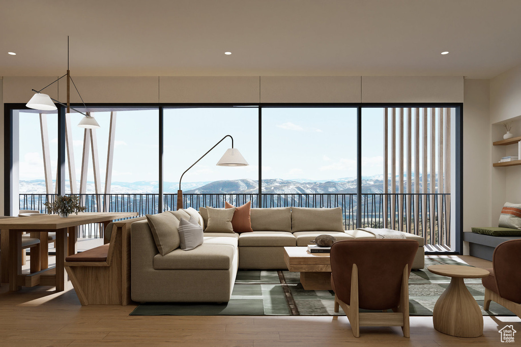 Living area featuring recessed lighting, a mountain view, and wood finished floors