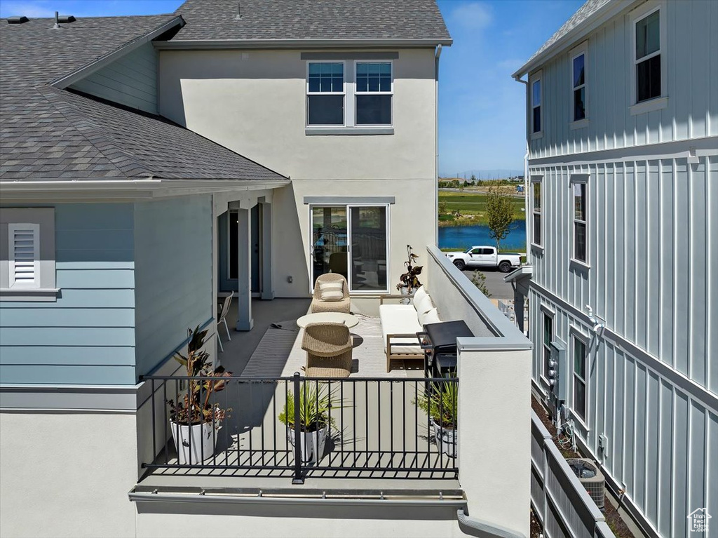 Exterior space with fence and a water view