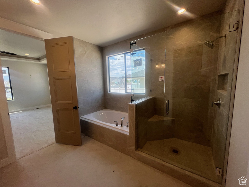 Full bathroom with a bath, a stall shower, and recessed lighting