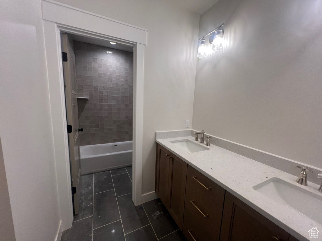 Bathroom with tile patterned flooring and double vanity