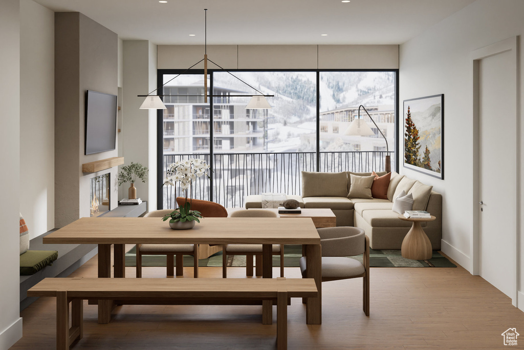 Dining space with a notable chandelier and wood finished floors