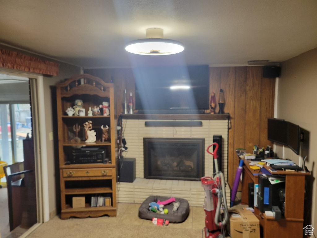 Living room featuring carpet flooring and a fireplace