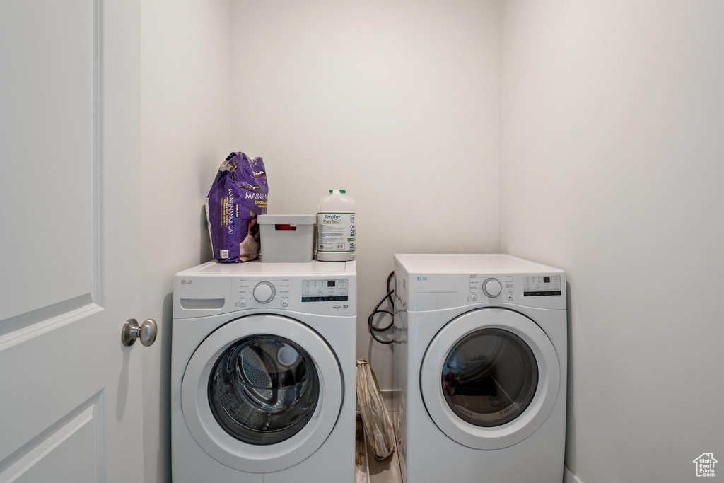 Laundry area featuring independent washer and dryer and laundry area