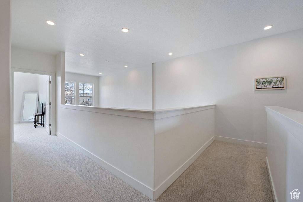 Hall featuring recessed lighting, baseboards, and carpet