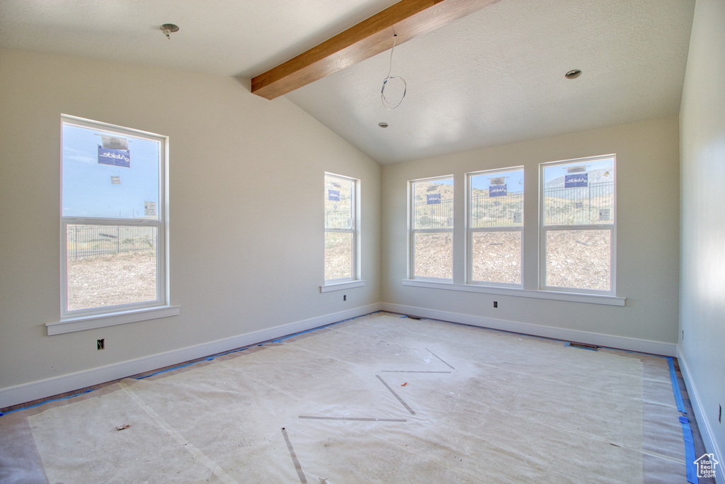 Spare room featuring baseboards