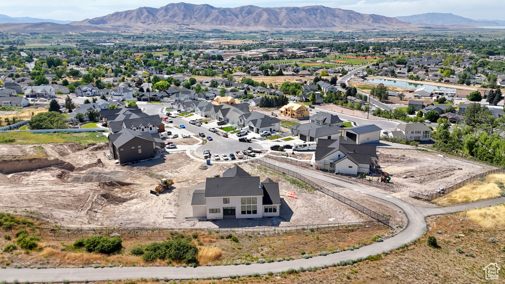 Aerial perspective of suburban area featuring a mountainous background