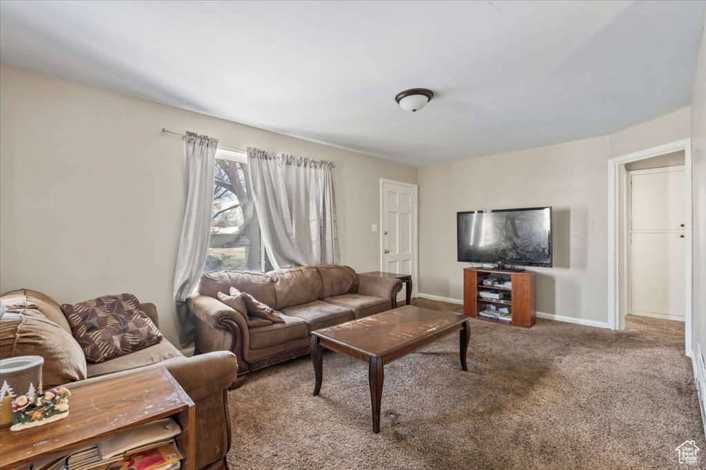 Living area with carpet and baseboards