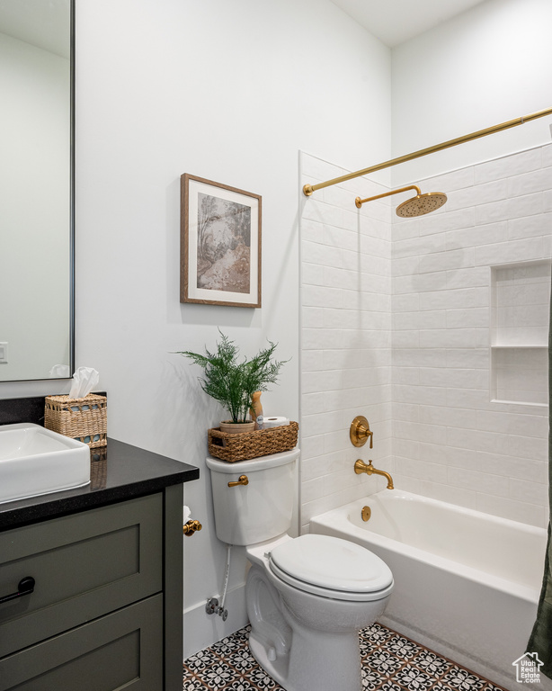 Full bath with toilet, vanity, and bathtub / shower combination