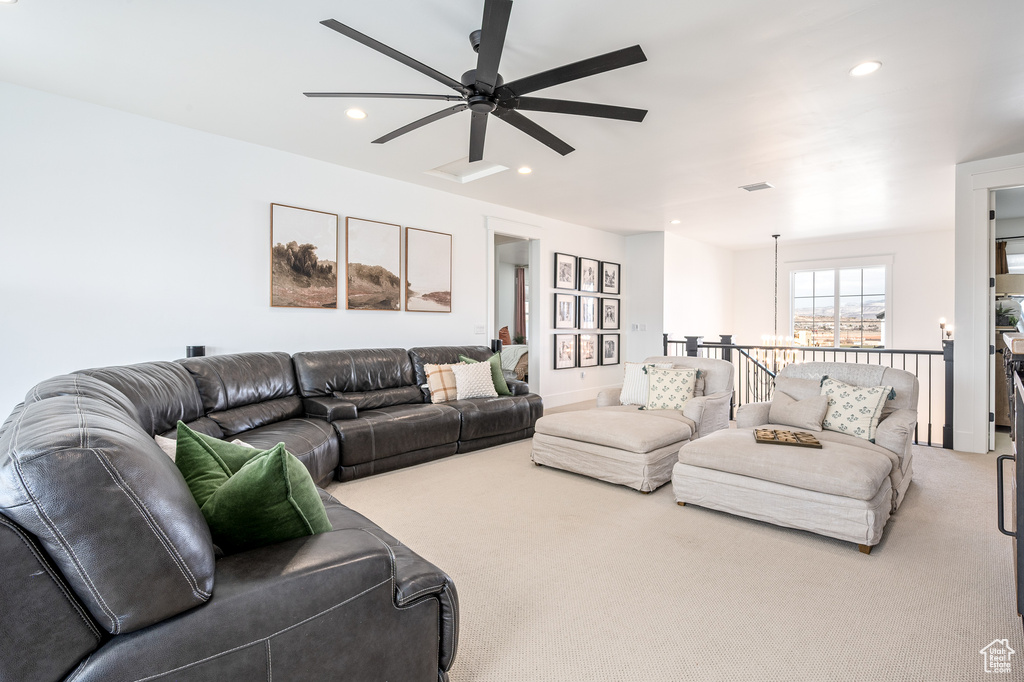 Living area featuring recessed lighting, visible vents, carpet floors, and a ceiling fan