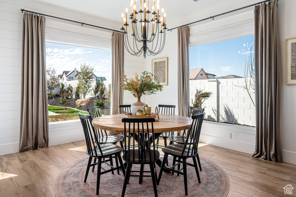 Dining room with an inviting chandelier and wood finished floors