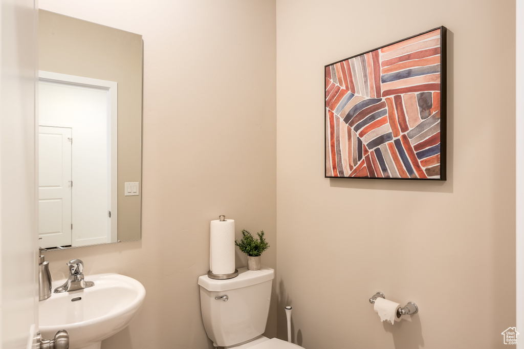 Bathroom featuring toilet and a sink