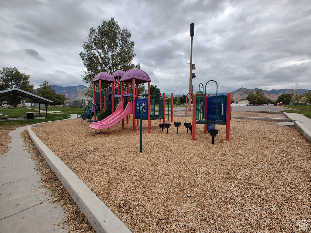 Communal playground featuring a mountain view