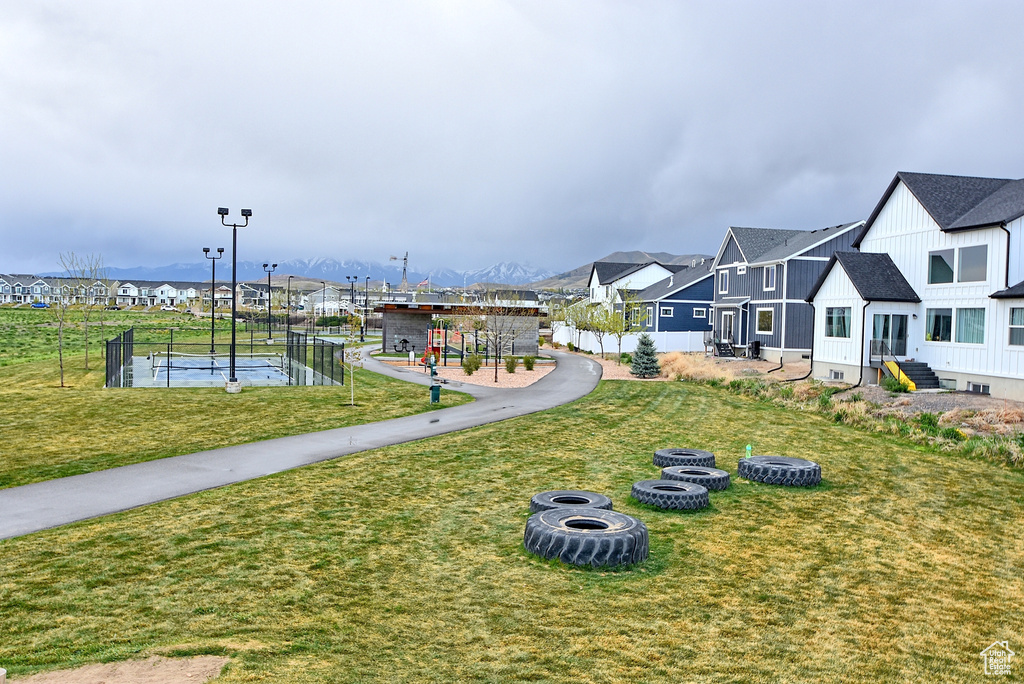 View of community with a residential view and a lawn
