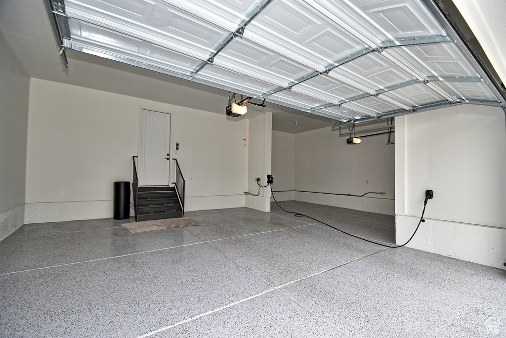 Garage featuring a garage door opener