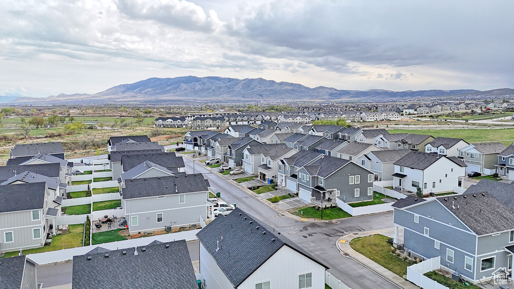 Birds eye view of property with a mountain view and a residential view