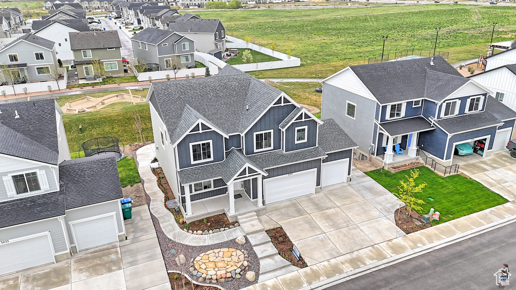 Birds eye view of property with a residential view