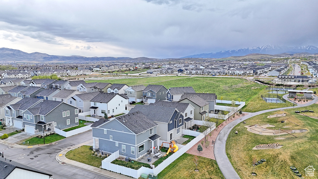 Drone / aerial view featuring a mountain view and a residential view