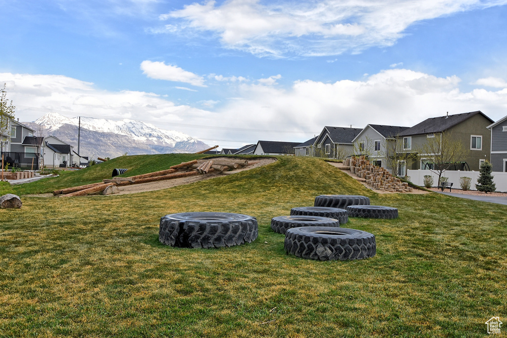View of yard featuring a residential view and a mountain view