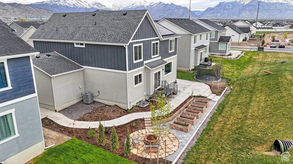 Drone / aerial view featuring a mountain view and a residential view