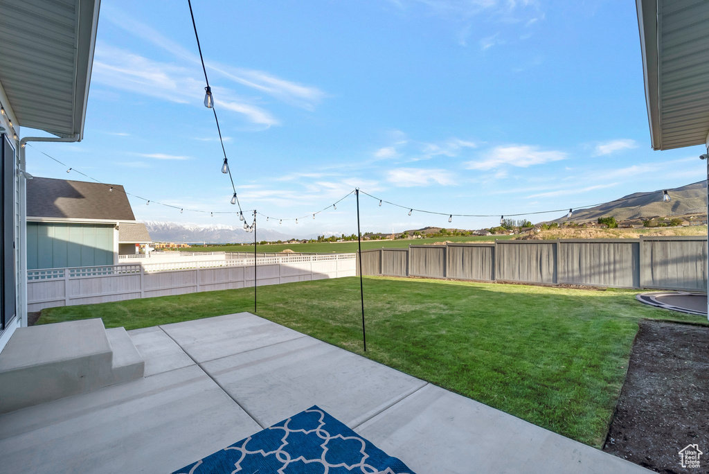 View of yard with a patio area and a mountain view