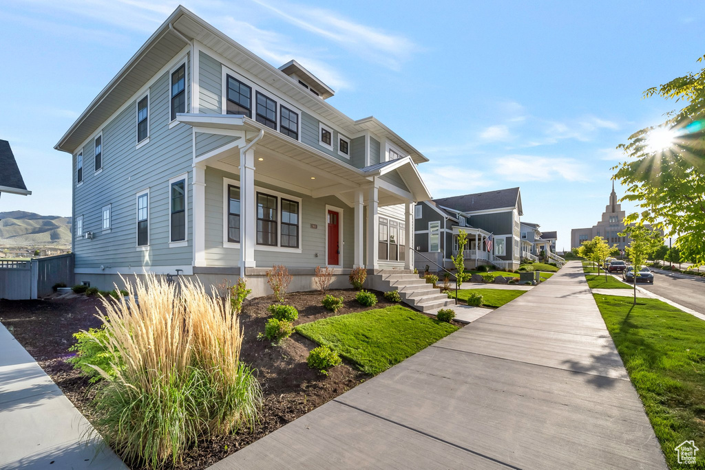 Traditional style home featuring covered porch