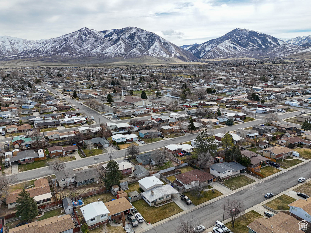 Birds eye view of property featuring a mountain view and a residential view