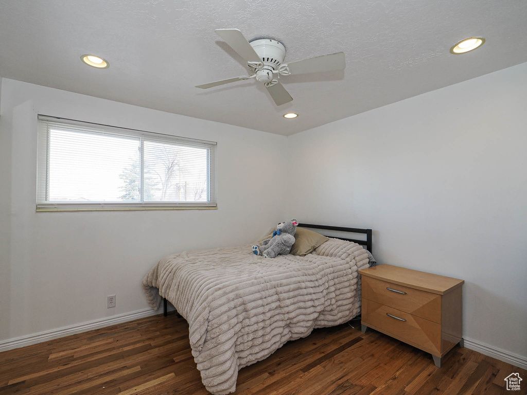 Bedroom featuring recessed lighting, baseboards, and wood finished floors