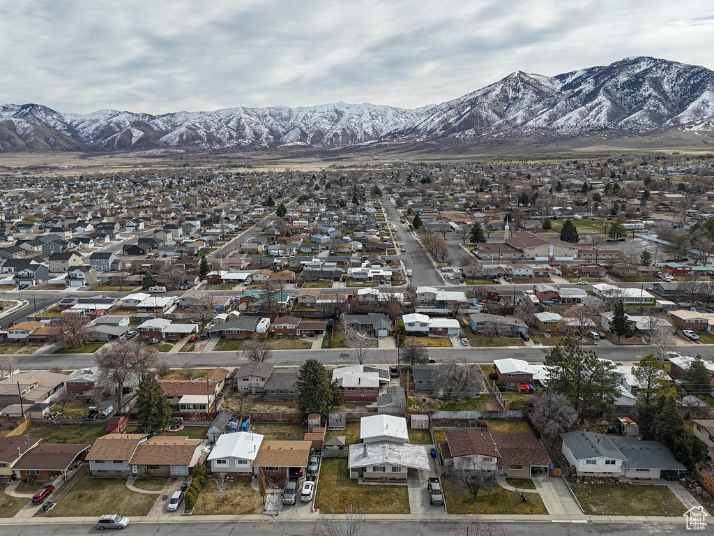 Birds eye view of property with a residential view and a mountain view