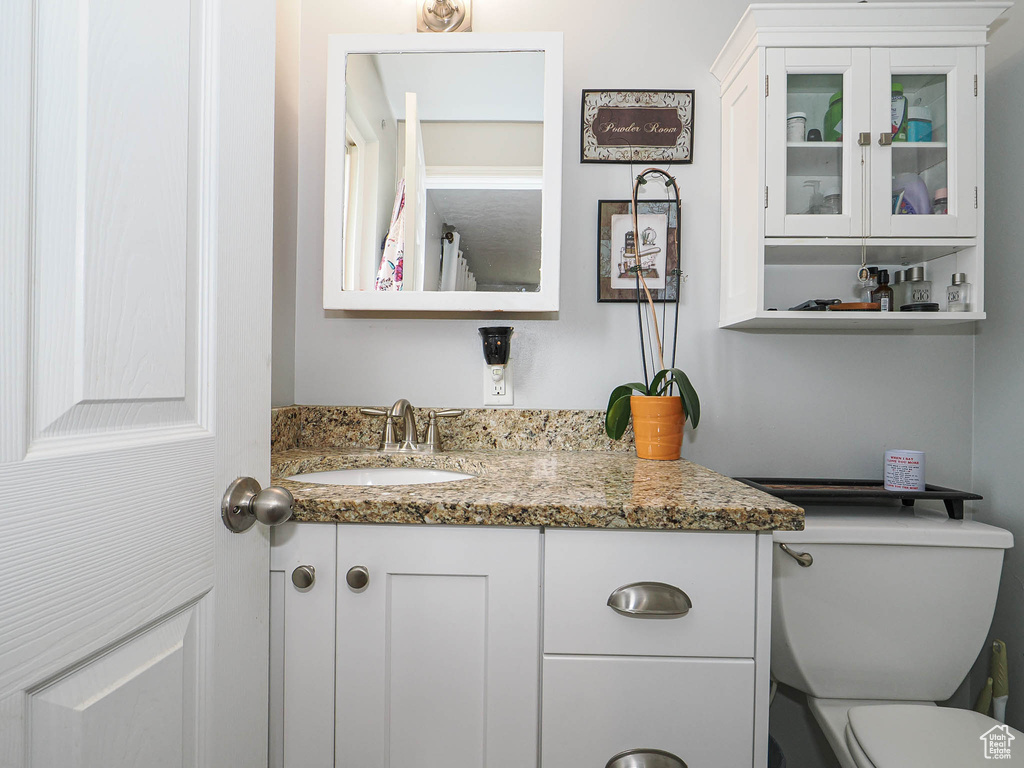 Bathroom with toilet and vanity