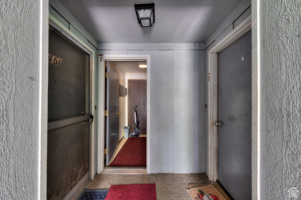 Hallway featuring carpet flooring
