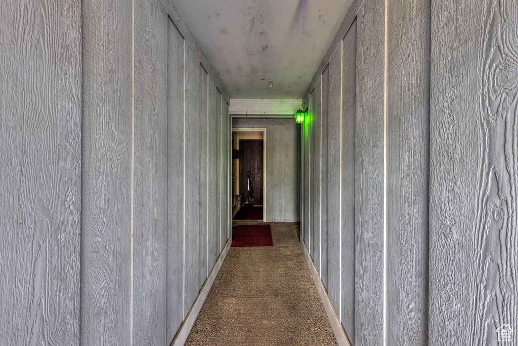 Corridor featuring carpet