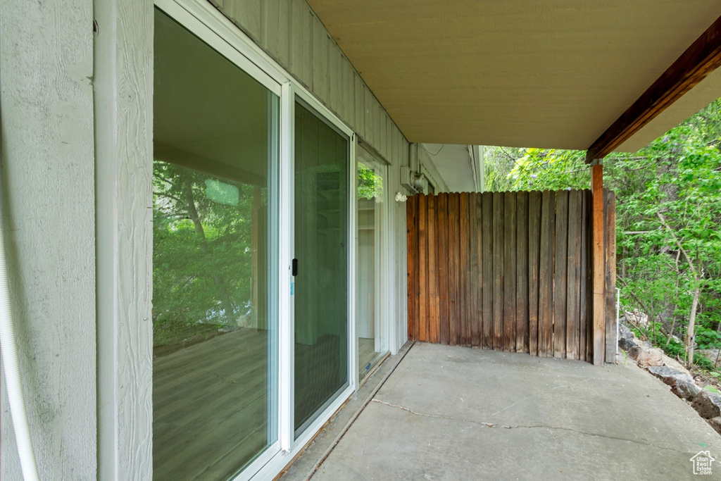View of patio with fence
