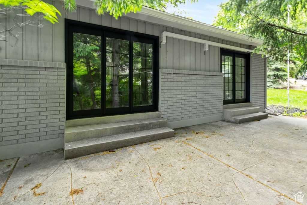 Property entrance with brick siding