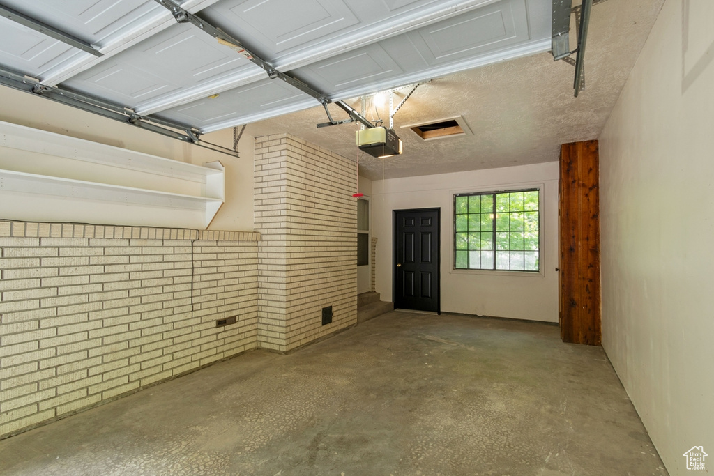 Garage featuring a garage door opener