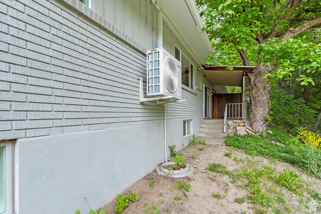 View of side of property with ac unit