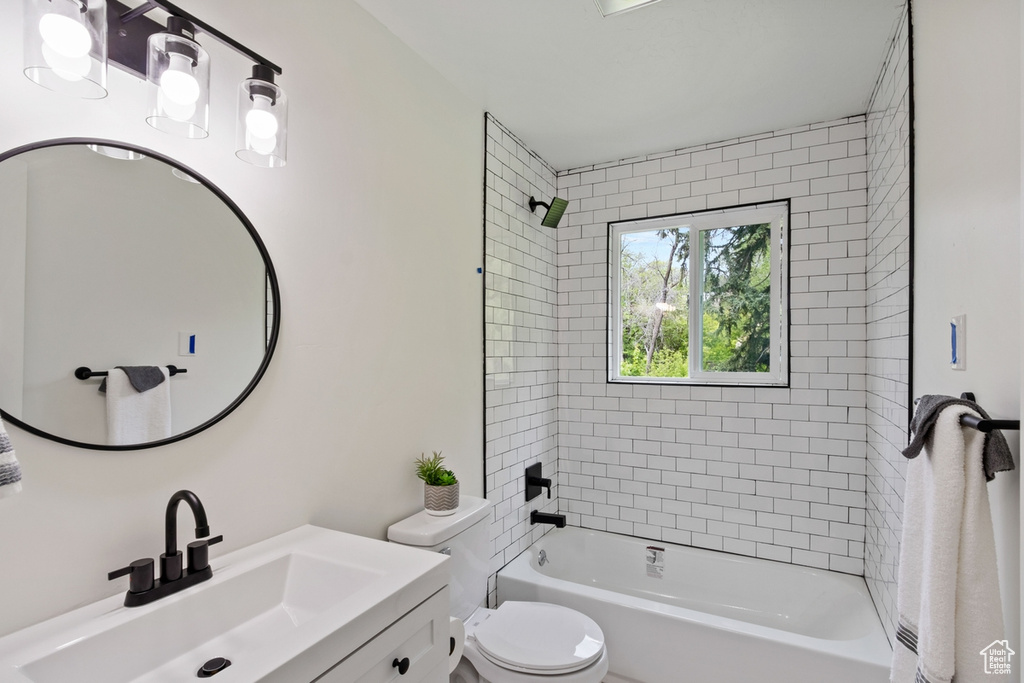 Full bath featuring vanity, toilet, and shower / bathtub combination