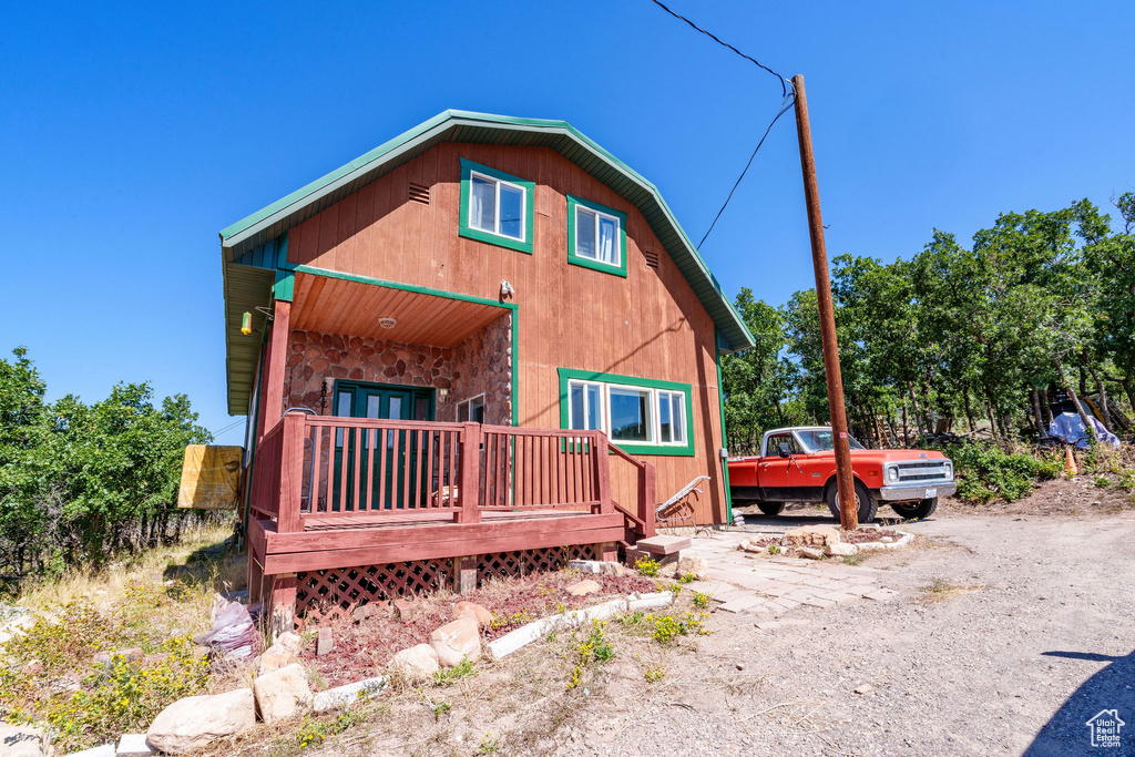Back of property featuring french doors
