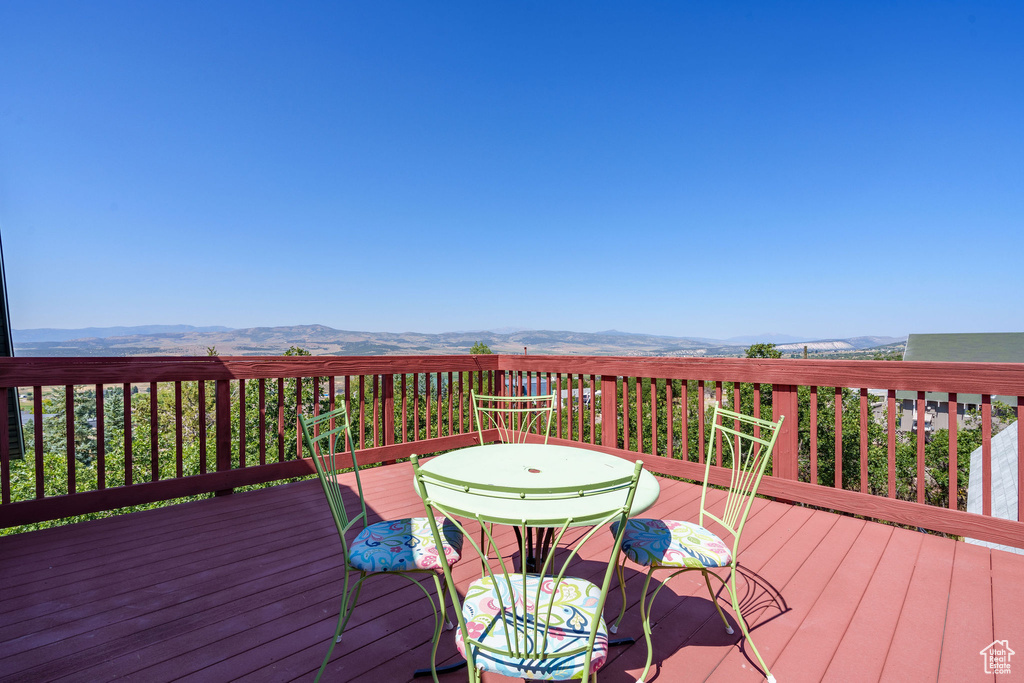 Wooden deck featuring a mountain view