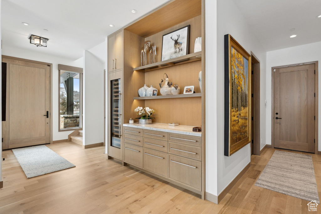 Foyer featuring recessed lighting, light wood-type flooring, and baseboards