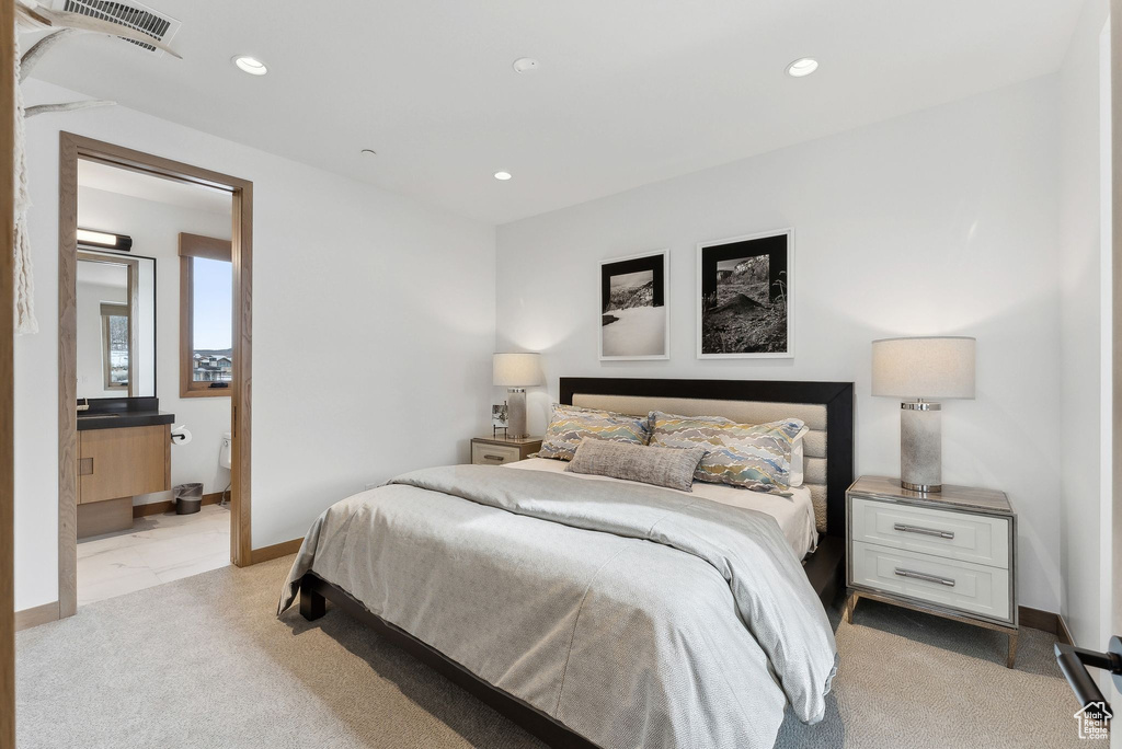 Bedroom with recessed lighting, visible vents, light colored carpet, and baseboards