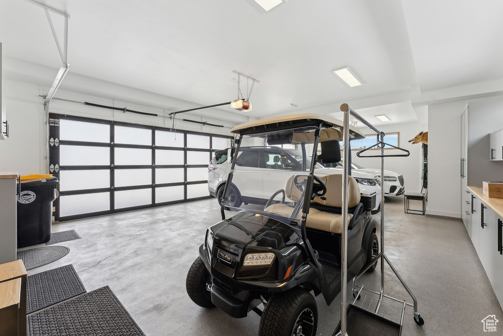 Garage featuring a garage door opener