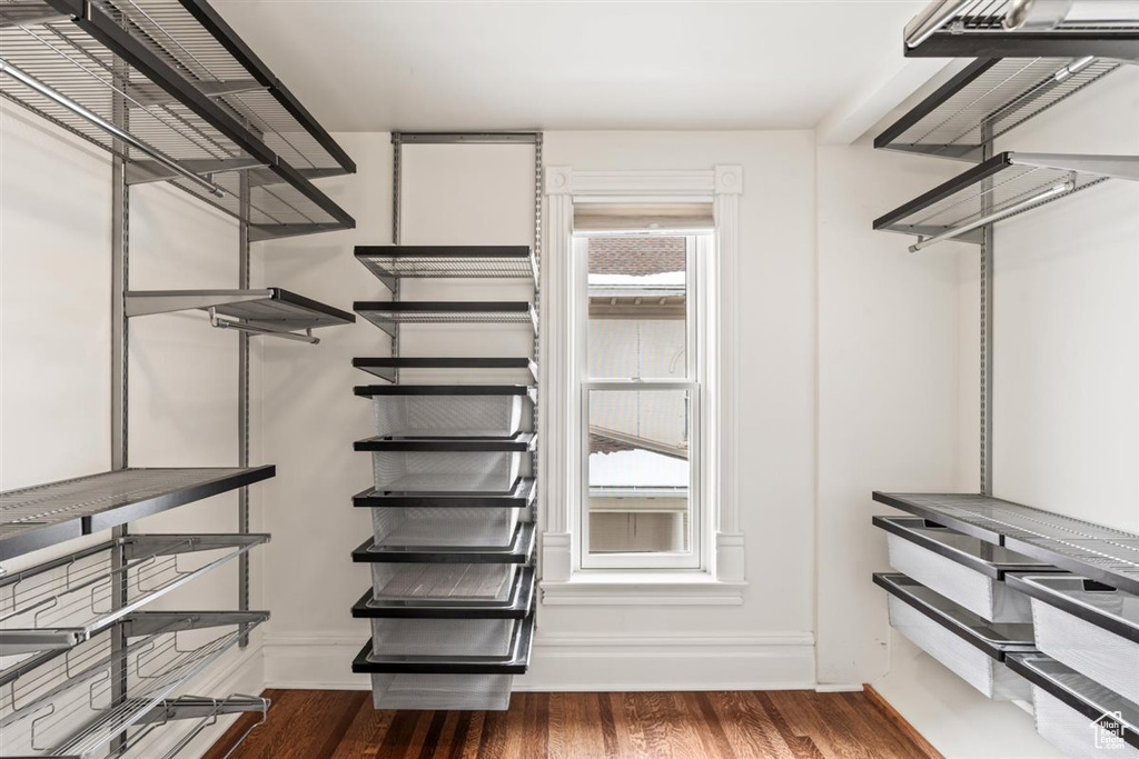 Spacious closet with wood finished floors